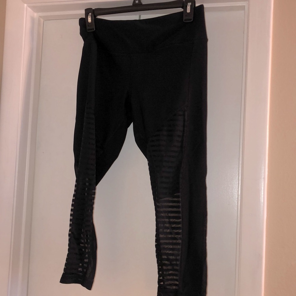90 Degree Capri leggings with striped sheer cutouts on the lower leg- size M